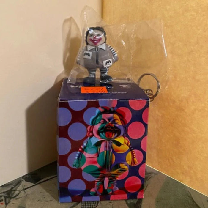 Ron English blind box keychain grey & white Available Now - Tenacious Toys®