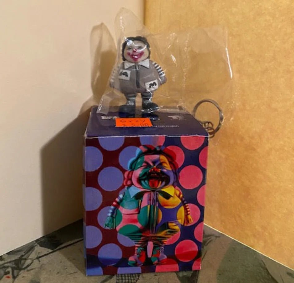 Ron English blind box keychain grey & white Available Now - Tenacious Toys®