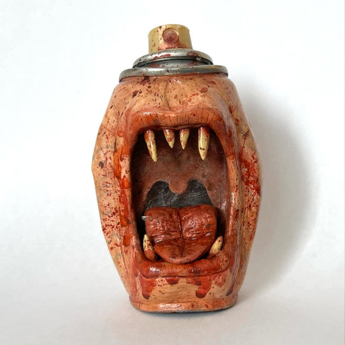 Hand-painted monster sculpture emerging from a miniature spray can by artist NEMO